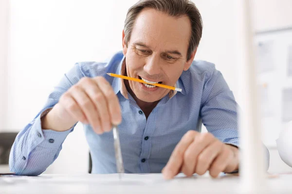 Professional engineer drawing a blueprint — Stock Photo, Image