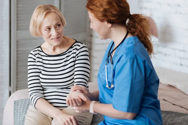 doctor examining ladies heart rate