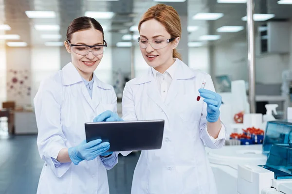 Colleagues looking at screen of the tablet — Stock Photo, Image