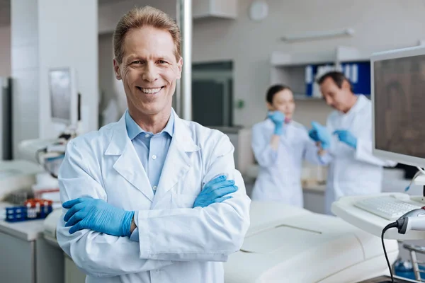 Smiling man crossing arms on the chest — Stock Photo, Image