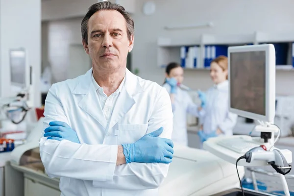 Serious male person crossing arms on chest — Stock Photo, Image