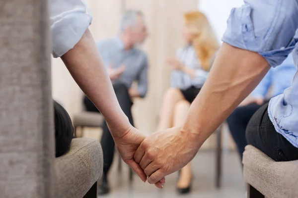 Nice pleasant people holding their hands — Stock Photo, Image