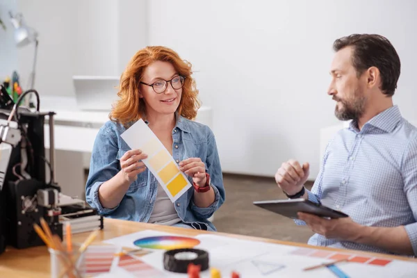 Attractive smart designer choosing the colour — Stock Photo, Image