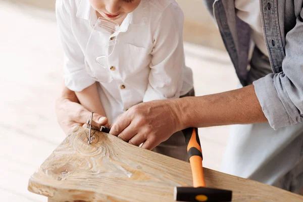 Close up photo of male hands while making bench — Stock Photo, Image