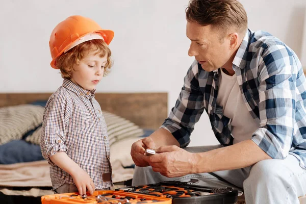 Serious father talking to his little son — Stock Photo, Image