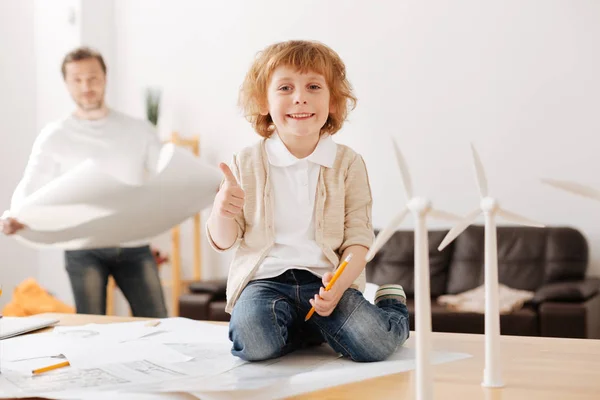 stock image Positive delighted kid being pleased with new toys