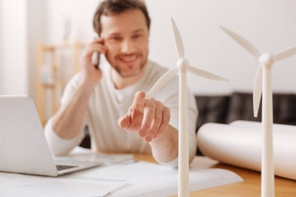 Close up of little windmills that standing on the table