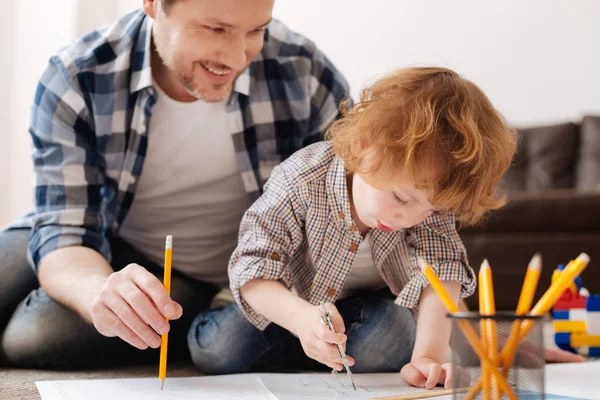 Diligent boy while drawing circle on the draft — Stock Photo, Image