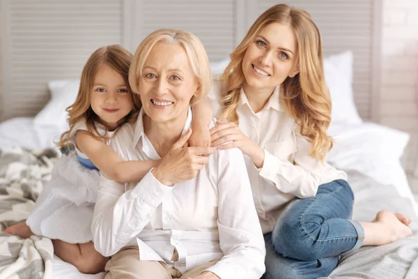 Lovely extended family hugging each other — Stock Photo, Image