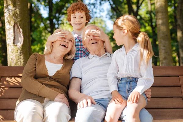 Happy grandparents spending time with children — Stock Photo, Image