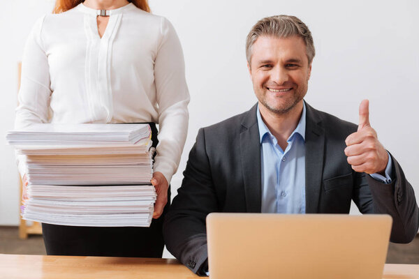 Admirable cheerful man loving his job