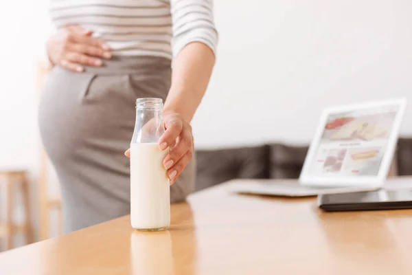 Botella de leche en la oficina —  Fotos de Stock