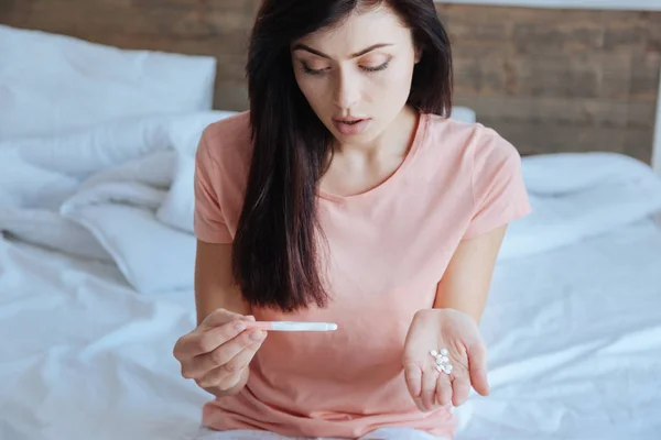 Young girl scared by pregnancy test results — Stock Photo, Image