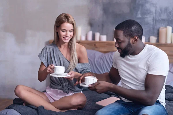 I couple enjoying tea at home — стоковое фото