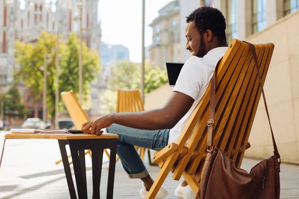 Passionate charismatic man checking his notifications — Stock Photo, Image