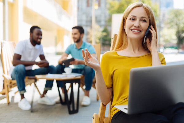 Gorgeous intelligent woman talking to her employer