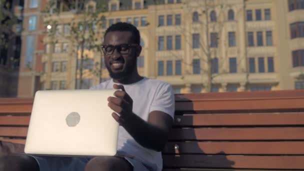 Excited man finishing work and drinking coffee — Stock Video