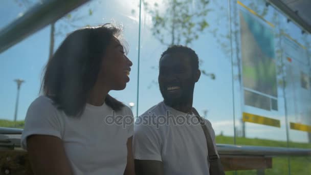 Cheerful young people chatting and smiling — Stock Video