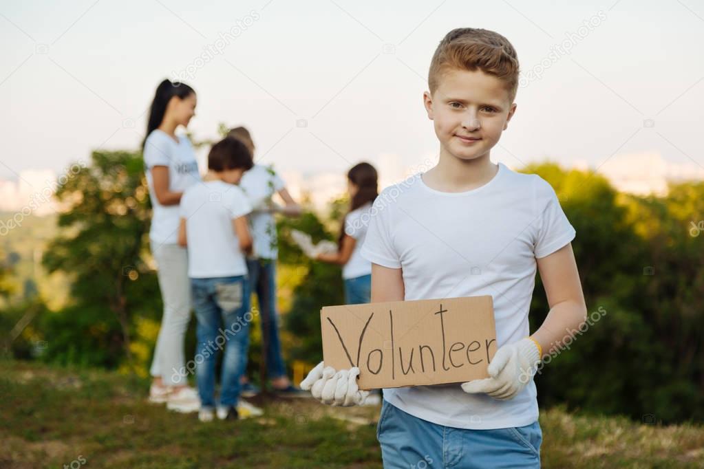 boy inviting you to volunteer team 