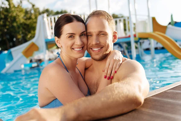 Lovely couple bonding in a swimming pool — Stock Photo, Image