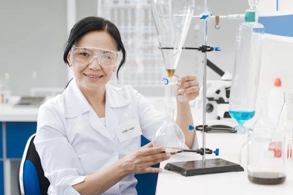 Pleasant positive chemist looking at you — Stock Photo, Image