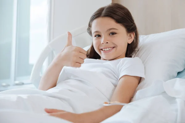 Happy delighted girl showing thumbs up gesture — Stock Photo, Image