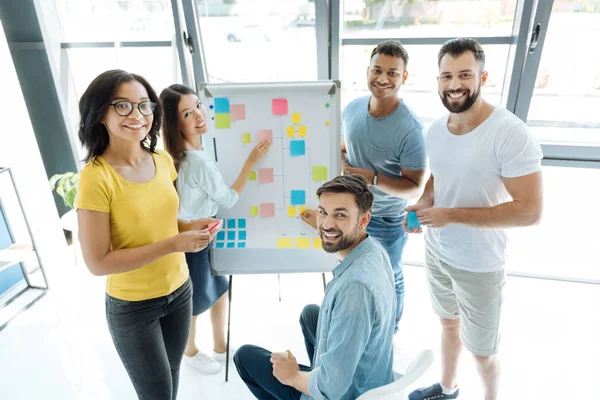 Team of creative positive people looking at you — Stock Photo, Image