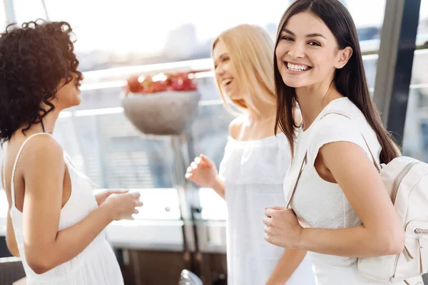 Happy delighted woman holding a bag — Stock Photo, Image