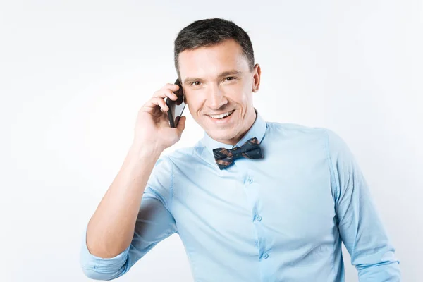 Delighted positive man making a call — Stock Photo, Image