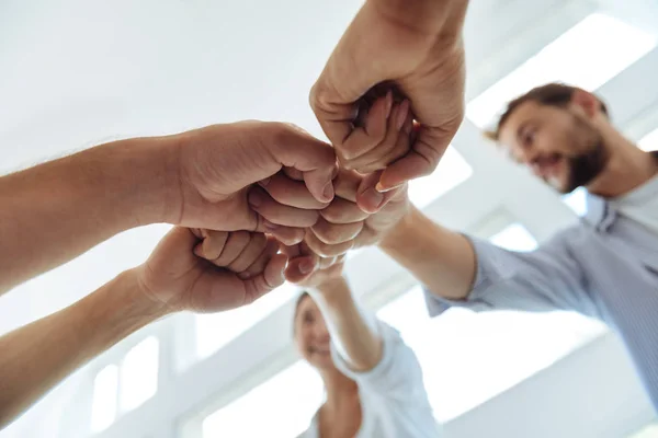 Close up of fists being held together — Stock Photo, Image