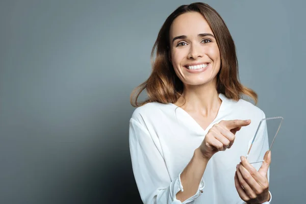 Joyful positive woman using her smartphone — Stock Photo, Image