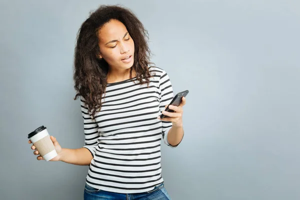 Attentive international female reading message — Stock Photo, Image