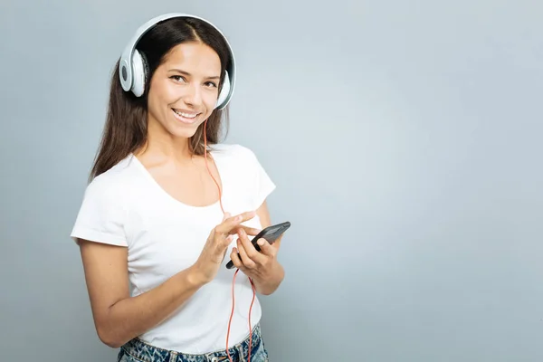 Chica alegre escuchando música favorita —  Fotos de Stock