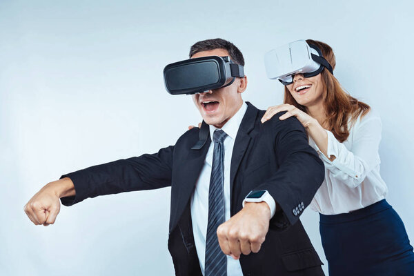 Business colleagues playing visual reality games