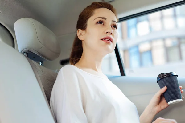 Thoughtful smart woman drinking coffee — Stock Photo, Image