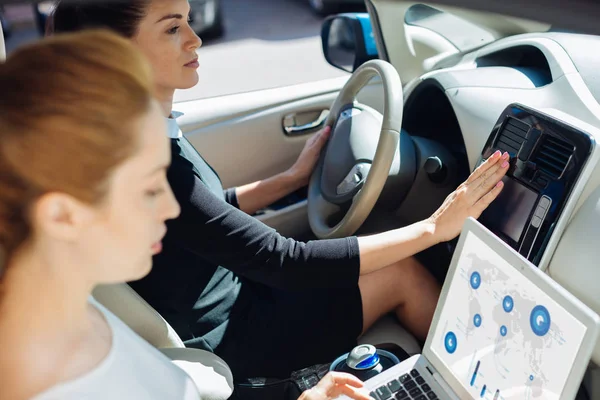 Smart serious businesswoman driving a car — Stock Photo, Image