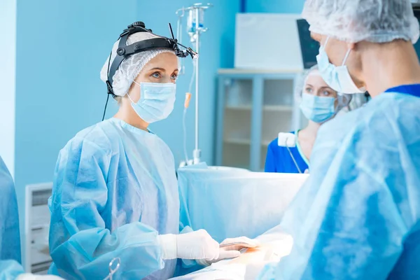 Serious practitioner helping her patient — Stock Photo, Image