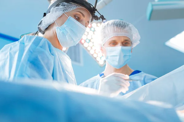 Serious surgeon being at his workplace — Stock Photo, Image