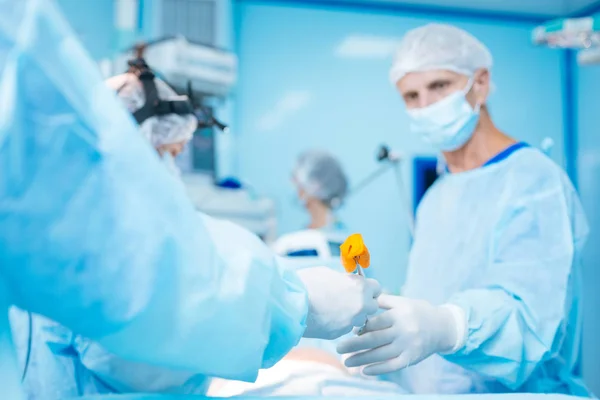 Close up of male hand that holding instrument — Stock Photo, Image