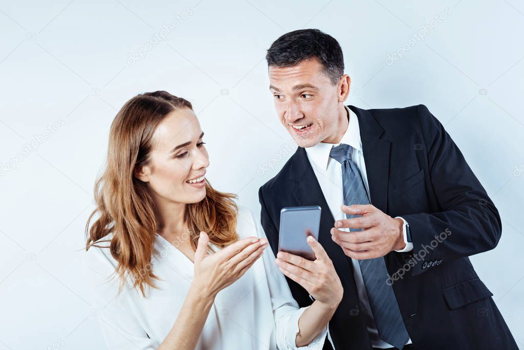 Positive minded coworker discussing something on phone