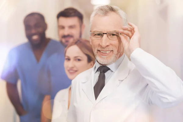 Competent professor touching his glasses — Stock Photo, Image