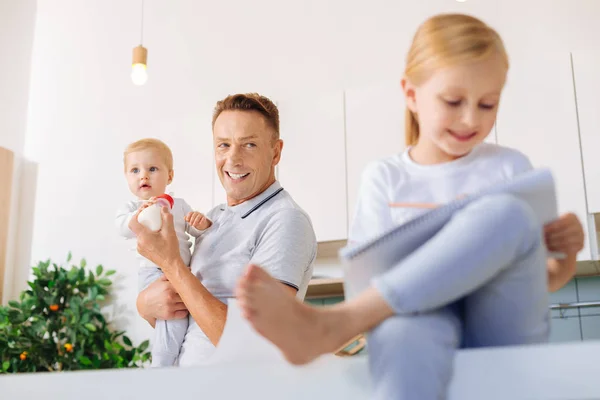 Happy positive man looking at his child — Stock Photo, Image