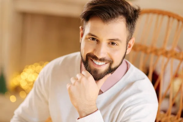 Portrait of dark-haired resting his chin on hand — Stock Photo, Image