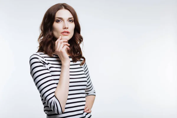 Charming woman touching her chin while posing — Stock Photo, Image