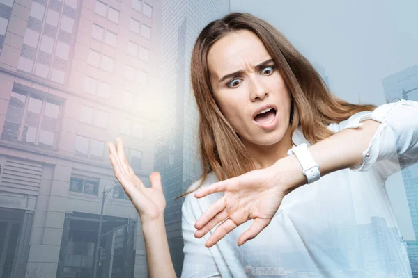 Unhappy surprised woman looking at her watch — Stock Photo, Image