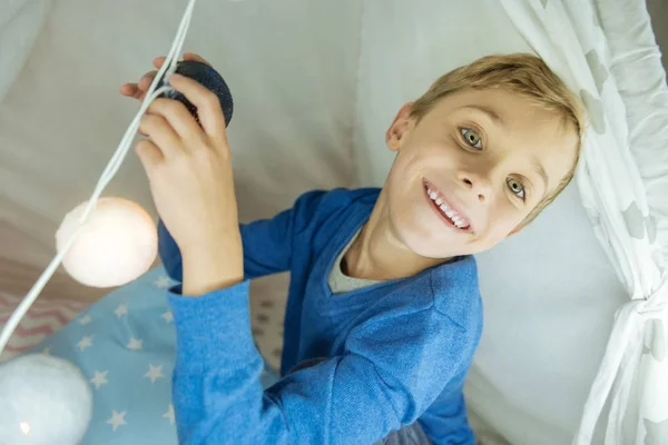 Delighted child touching his toy — Stock Photo, Image