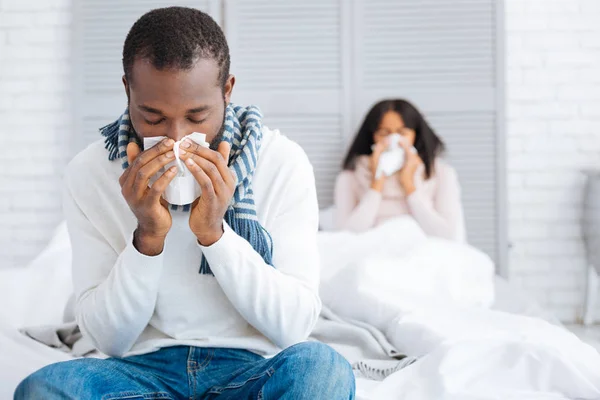 Unpleasant day of a young ill couple — Stock Photo, Image