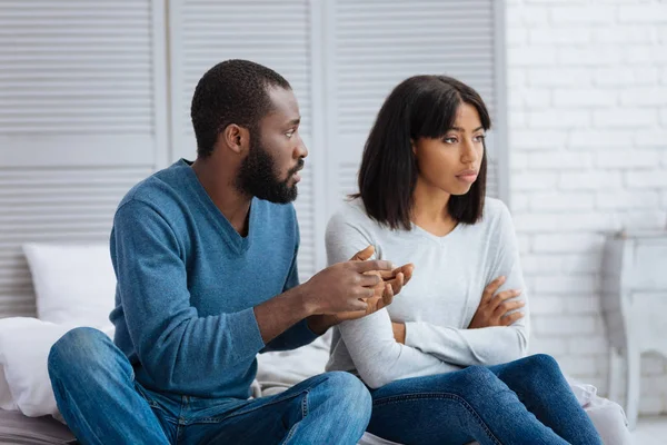 Kind calm man explaining the situation to his girlfriend — Stock Photo, Image