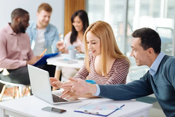 Concentrated woman typing text for presentation