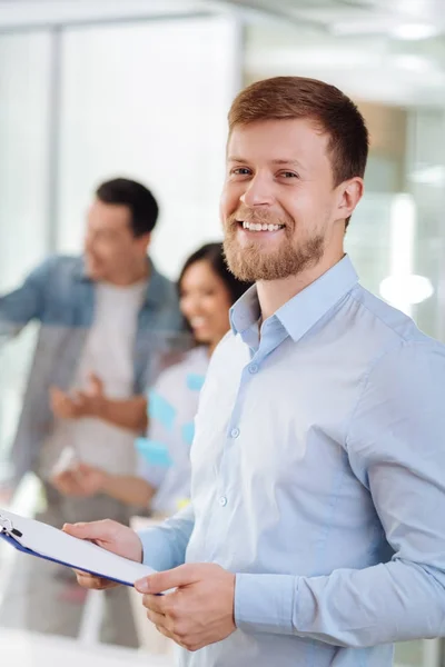 Portrait of delighted man that standing in office — Stock Photo, Image